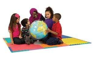 Diverse children sitting holding a globe - about