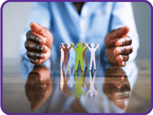 Hands Sheltering Cirlcle Of Paper Figures